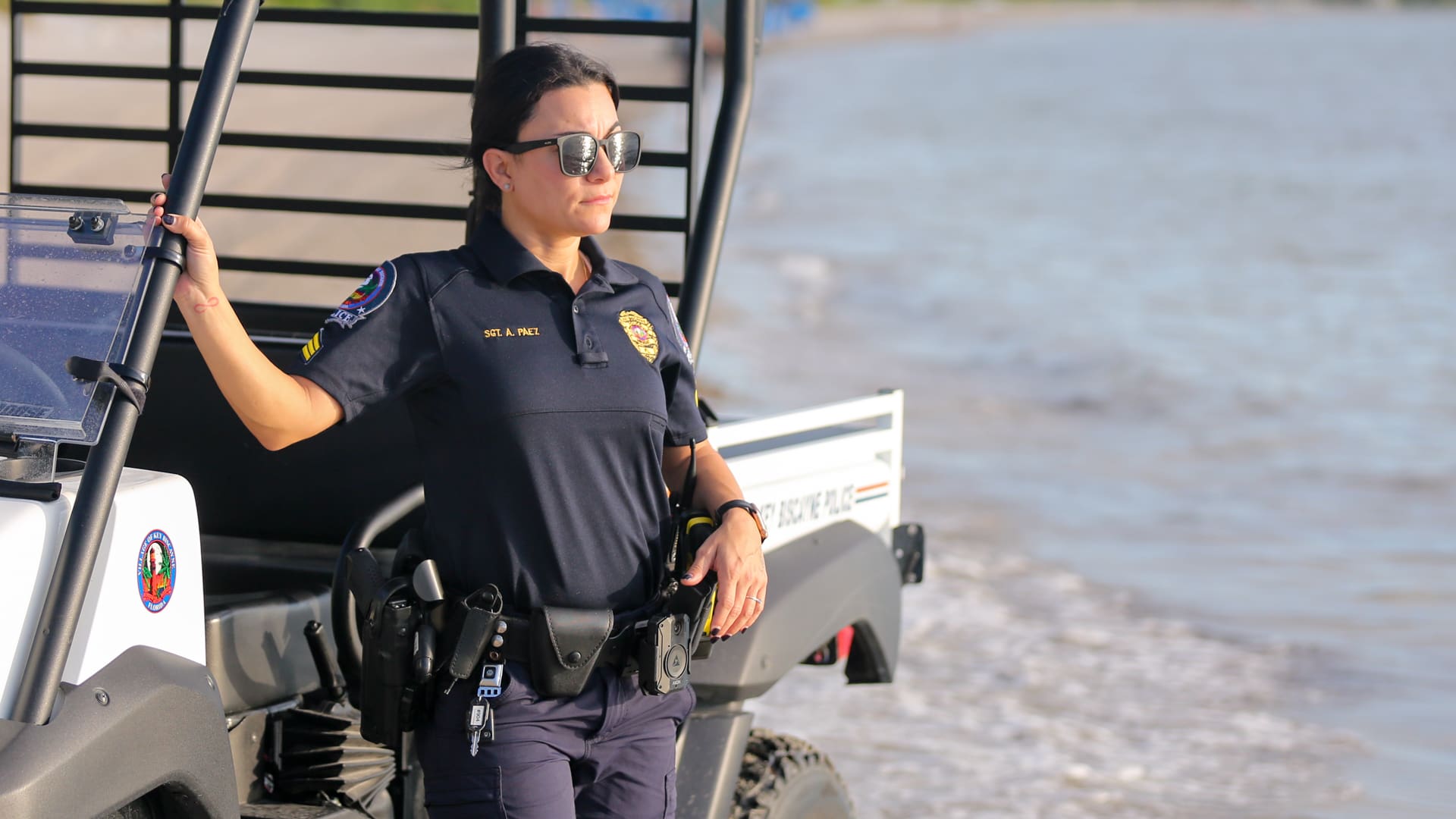 Police Sgt. Anais Paez stands near beach vehicle
